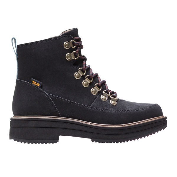 The Teva Womens Midform Boot Black features metal eyelets, red and black laces, a thick ridged sole, a yellow Teva logo tag, and MAX-COMF insole technology. Shown from the side against a white background.