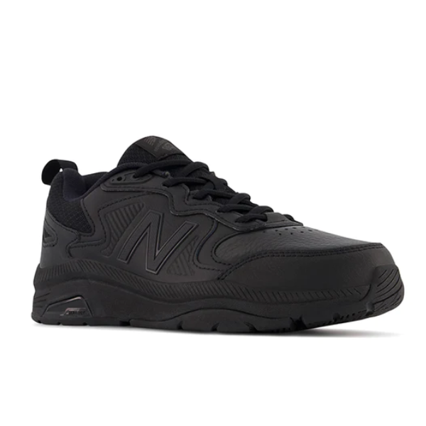 The New Balance Womens WX857 V3 Wide Black training shoe features a low-top design, lace-up closure, textured sole, signature N logo, and ROLLBAR technology, displayed on a white background.