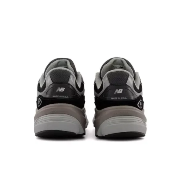 Two New Balance Mens 990 V6 Black running shoes are shown from the back with a grey, black, and white color scheme, MADE IN USA text, and the New Balance N logo on the heels, designed for comfort and support.