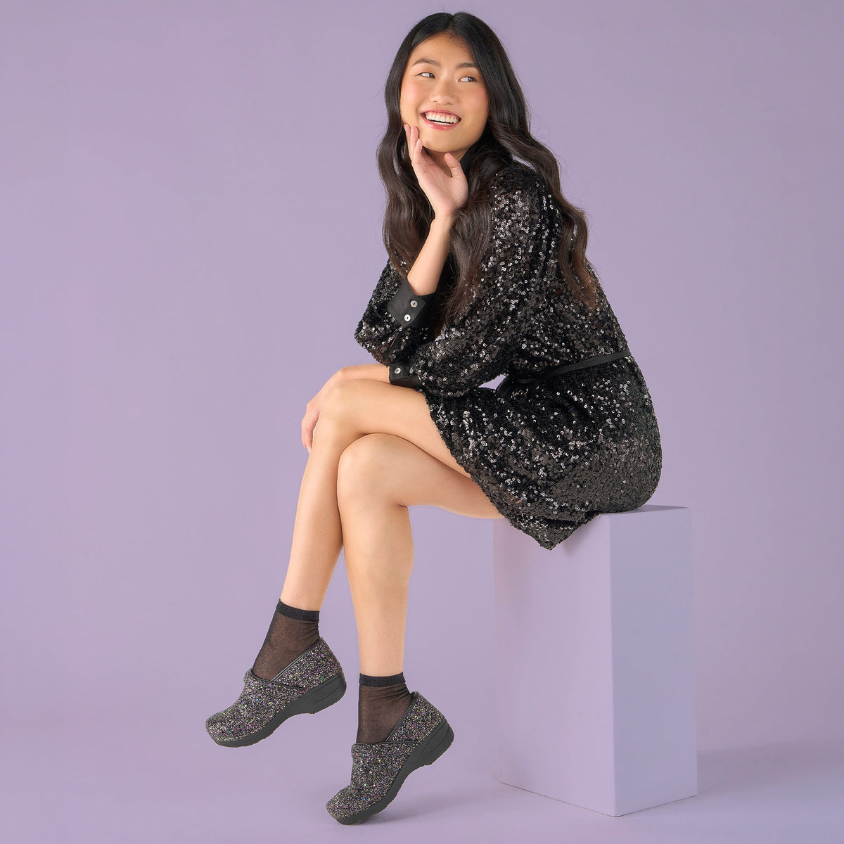 DANSKO Women's XP 2.0 Clog Black Glitter worn on foot, all-day arch support for standing work, lifestyle view.