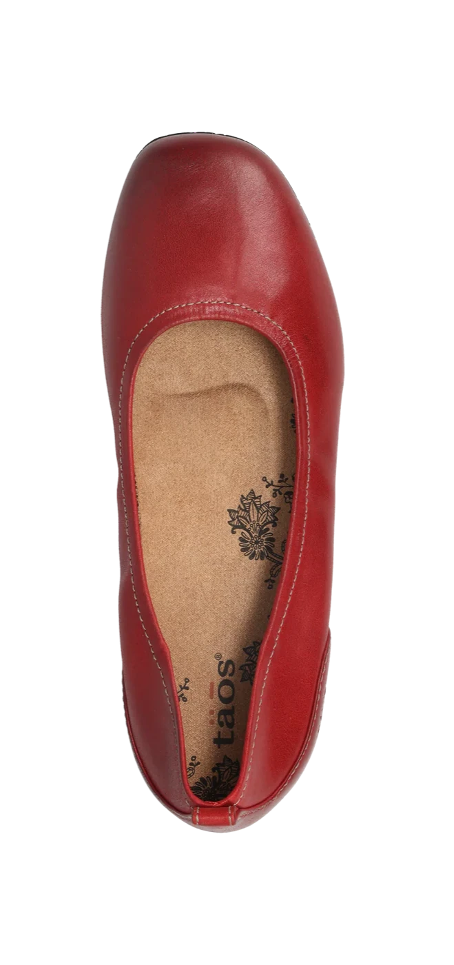 Top view of the TAOS Taos Womens Chit Chat Red leather skimmer flat, featuring a rounded toe, tan cushioned insole with floral print, and an orthotic-friendly design for added comfort.
