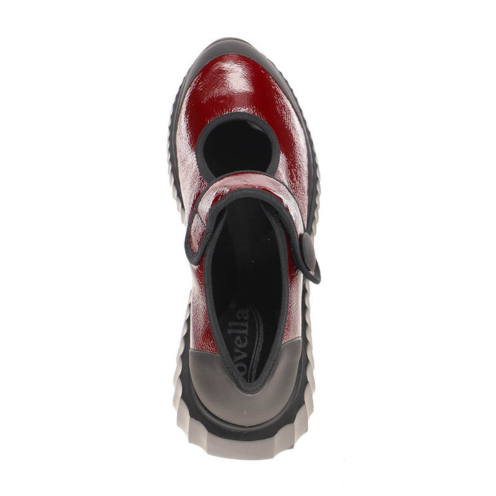 Top view of the Sovella Womens Jessica Red by SOVELLA—features a shiny red finish, black instep strap, and a thick, grooved gray sole for standout style among lightweight breathable shoes.