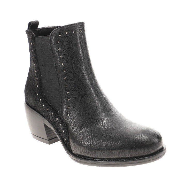 The SOVELLA Womens Misty Black boot features black leather, a low chunky heel, textured finish, elastic side panel, and metallic studded seams—crafted for stylish comfort and relief from heel pain.