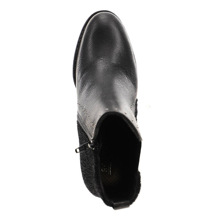 A top view of the Sovella Womens Misty Black ankle boot by SOVELLA, made of black leather with a side zipper, textured rear panel, and slightly pointed toe, designed for heel pain relief, shown on a white background.