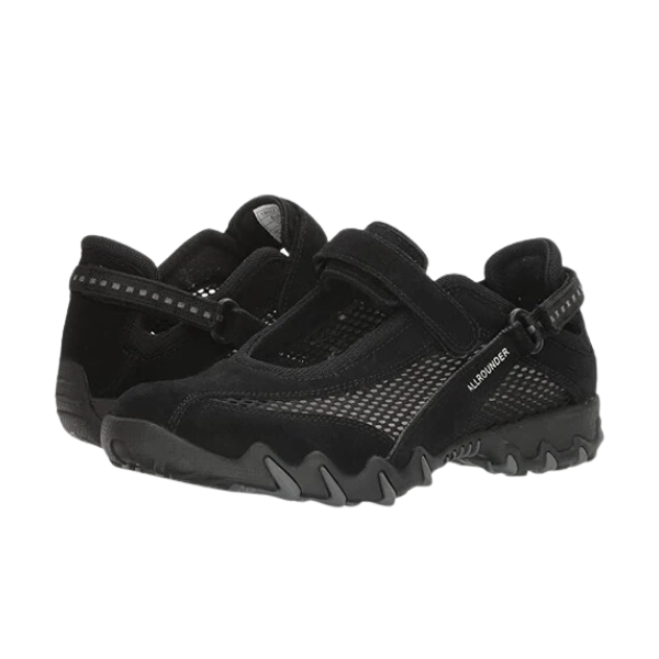 The Allrounder Womens Niro Black by ALLROUNDER features black mesh slip-on athletic shoes with adjustable Velcro straps and rugged rubber soles, designed for foot comfort. One shoe faces forward, the other displays the heel and side.