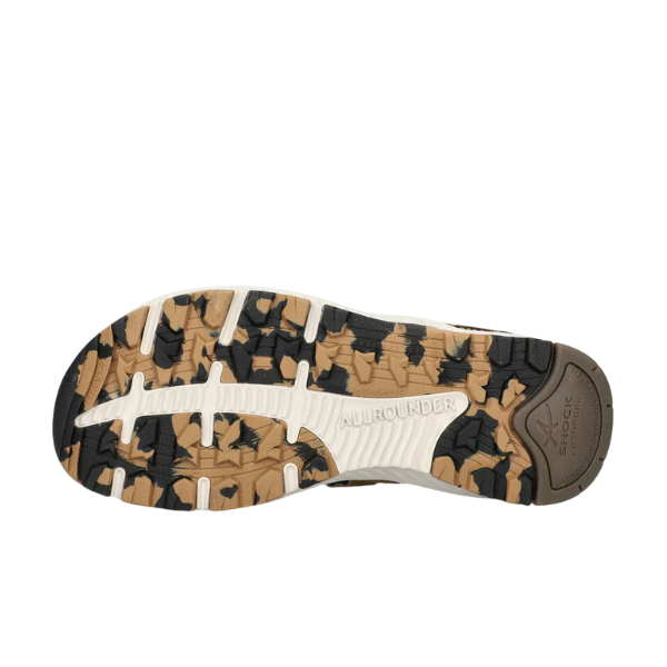 The image shows the bottom sole of the Allrounder Womens Westside Brown/Taupe sandal, featuring a rugged black, tan, and beige pattern with traction grooves and the embossed words ALLROUNDER and SHOCK ABSORBER.