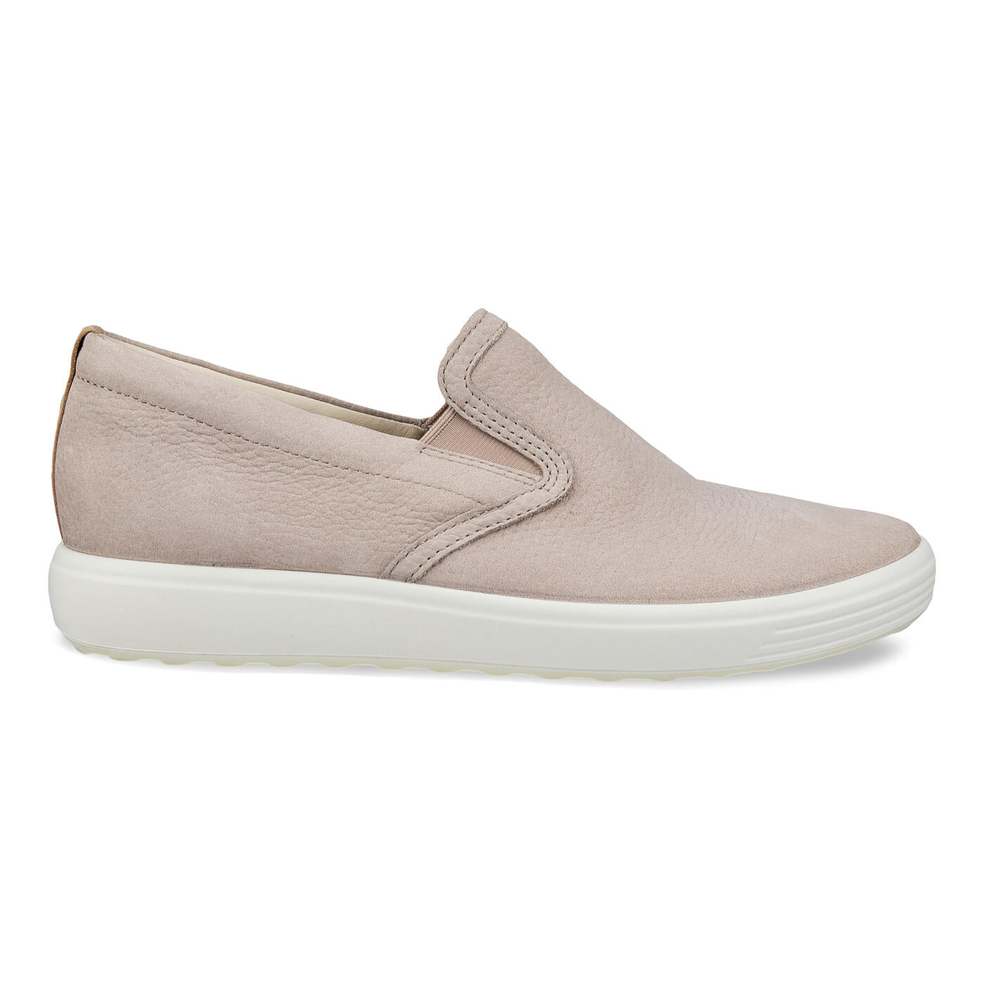 The ECCO Womens Soft 7 Slip-On Grey features a smooth full grain leather upper, elastic side panels, and a thick white rubber sole. Shown from the left side, this ECCO sneaker is displayed against a white background.