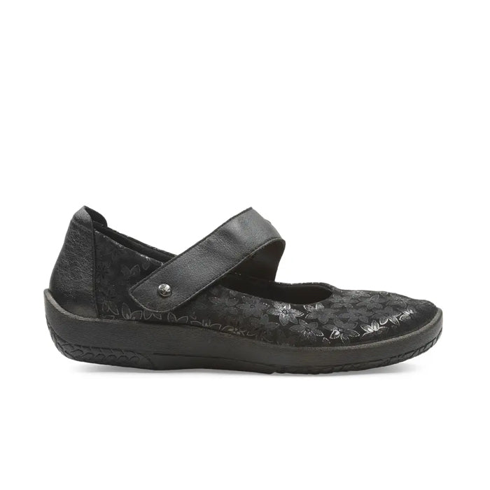 The Arcopedico Womens Cosmo Black by ARCOPEDICO is a black Mary Jane shoe featuring a textured floral design, adjustable strap, rounded toe, and supportive sole for comfort and foot pain relief.