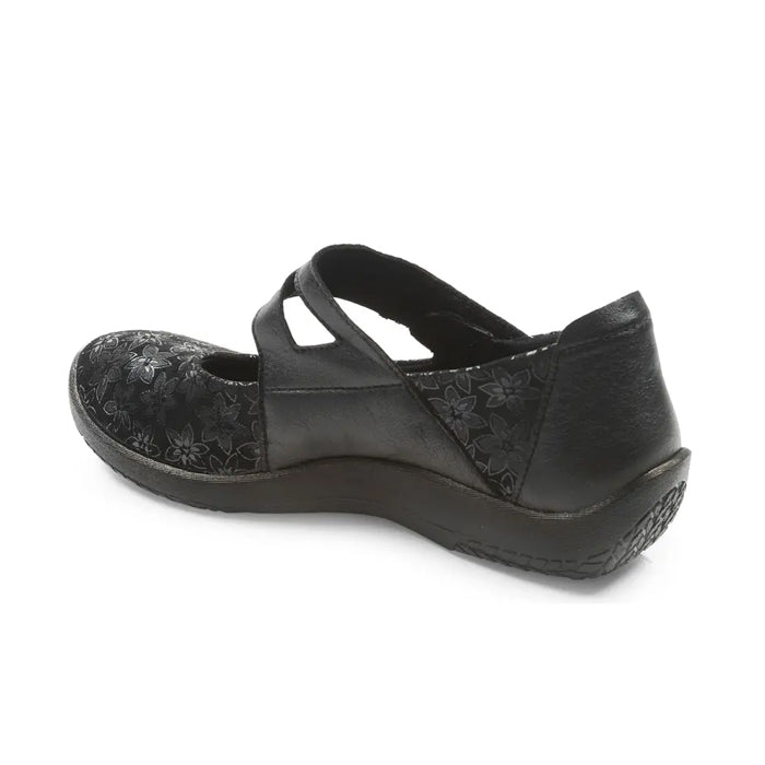 The ARCOPEDICO Arcopedico Womens Cosmo Black is a womens flat shoe with a floral pattern, round toe, crisscross straps, visible sole stitching, low wedge heel for foot pain relief, shown from the back left side.
