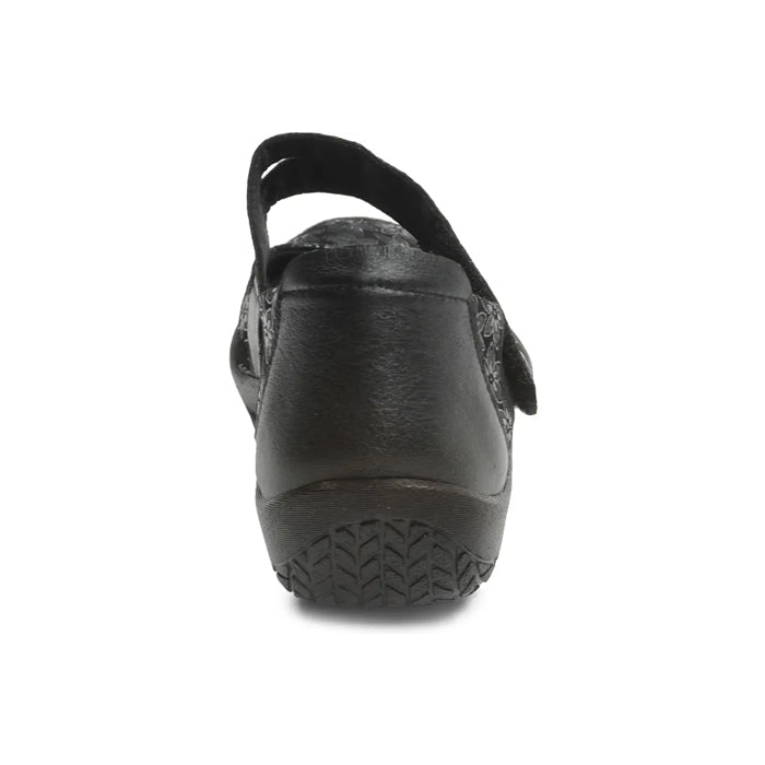 Rear view of the ARCOPEDICO Womens Cosmo Black shoe shows its textured sole and back strap, designed for foot pain relief, photographed on a plain white background.
