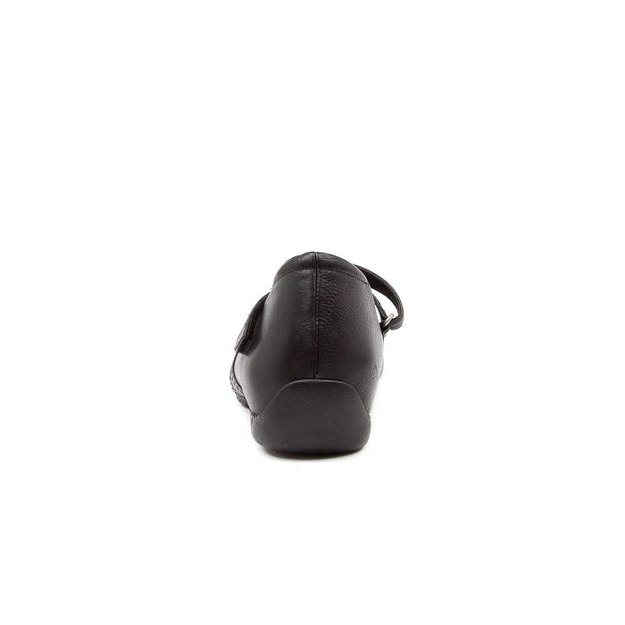 The ZIERA Womens Xray Wide Black mary jane shoe, shown from the back on a white background, highlights its supportive heel and side strap for enhanced comfort and foot pain relief.