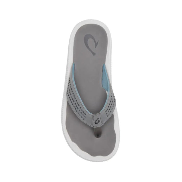 The OluKai Mens Ulele Stone/Stone sandal features a gray design with light blue accents and a white sole, shown from above against a white background.