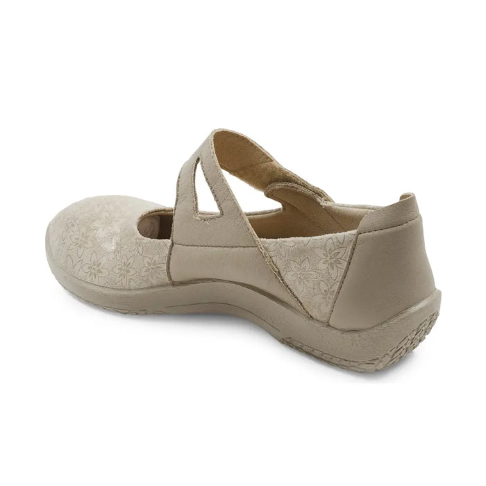 The ARCOPEDICO Womens Cosmo Taupe shoe features a Mary Jane style with two crisscross straps, a textured floral pattern, closed toe, and supportive sole, displayed from a rear-side angle.
