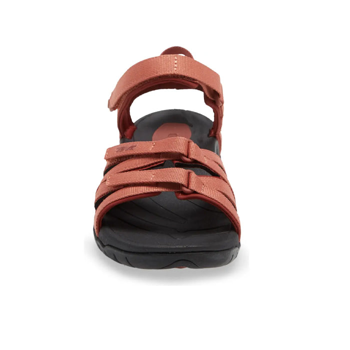 Front view of the Teva Womens Tirra Aragon sandal with three adjustable reddish-brown straps and a black cushioned sole, offering excellent arch support by Teva, displayed against a white background.