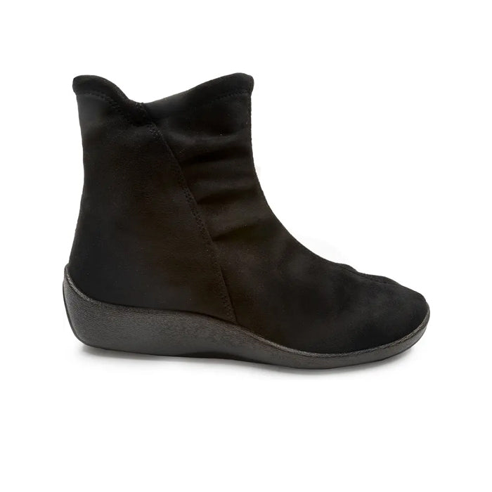 The ARCOPEDICO Arcopedico Womens L19 Stretch Bootie Black features a soft, suede-like upper and a flat orthopedic outsole, shown in side view against a white background—perfect for stylish foot pain relief.