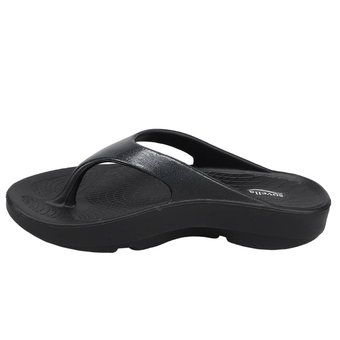 The Sovella Womens PF Thong Black/Metallic is a black flip-flop sandal by Sovella, featuring a thick contoured sole with arch support and a toe post strap, displayed from the side on a white background.