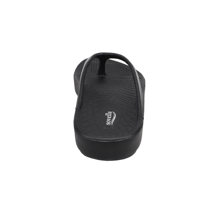 A rear view of the Sovella Womens PF Thong Black/Metallic sandal shows its textured footbed and straps. The Sovella brand highlights arch support and rebound tech. This comfort recovery sandal is centered on a white background.