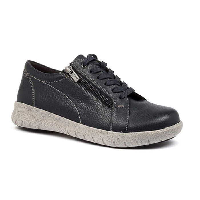 The ZIERA Womens Solar Black/White shoe is a black leather casual style with white stitching, side zipper, black laces, and a textured light gray rubber sole. Its supportive footbed ensures all-day comfort. Displayed on a white background.