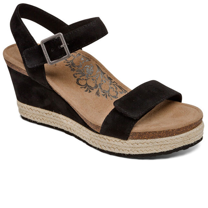 The Aetrex Womens Sydney Black by Aetrex features a black wedge sandal with ankle strap and buckle, cork and espadrille-style platform sole, floral tan insole, and a Memory Foam Footbed for comfort.