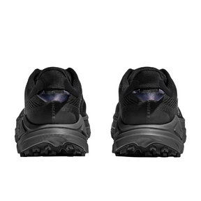 Black hiking shoes with tread pattern on sole on a white background