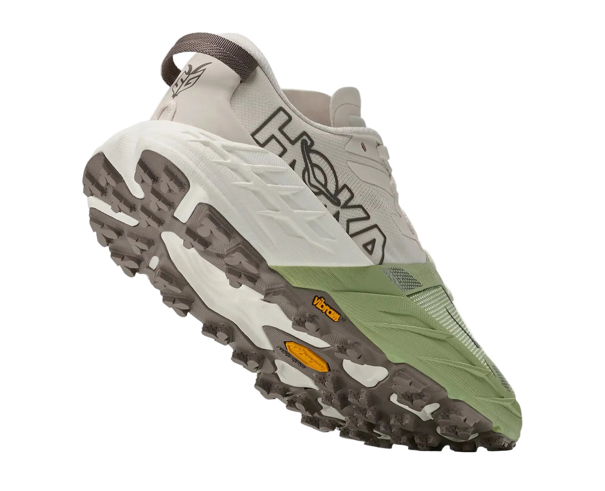 Outsole of the HOKA Women's Speedgoat 7 White/Green trail shoe, Vibram Megagrip tread with 5mm traction lugs.