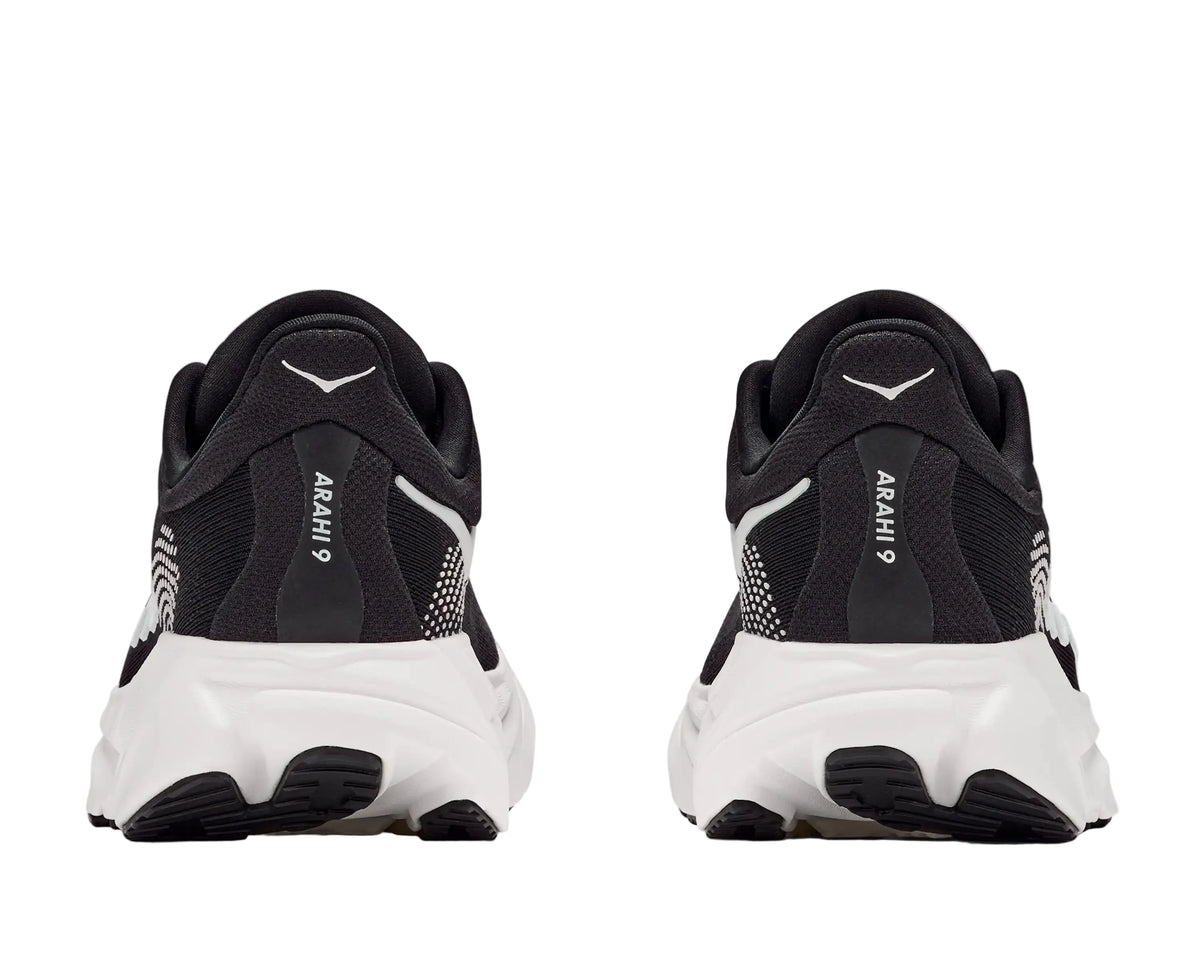 HOKA Men's Arahi 9 Wide Black/White running shoe, padded heel counter and white midsole, rear heel view.