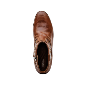 Top view of the Aetrex Women's Reagan Heel Boot in Cognac by AETREX WORLDWide INC, featuring brown leather, visible stitching, side zipper, branded interior, and built-in arch support for stylish comfort. Set against a white background.