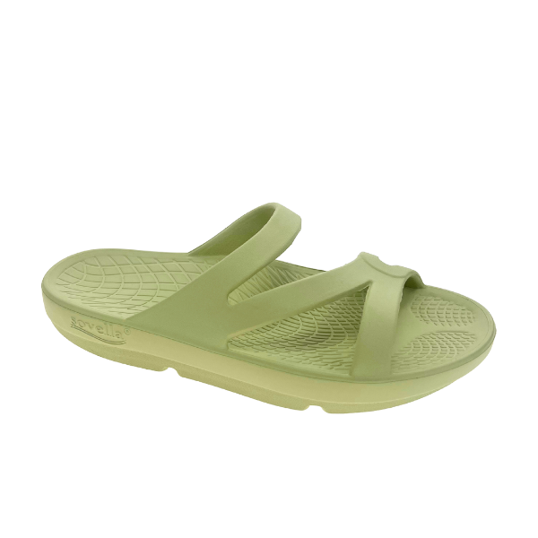 The Sovella Womens PF Green Slide by SOVELLA features two diagonal and one horizontal strap, a thick cushioned sole, arch support, and a textured footbed for all-day comfort.