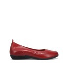 The TAOS Womens Chit Chat Red is a red leather skimmer flat with a rounded toe, black textured sole, slight wedge heel, visible stitching, orthotic-friendly design, and a pull tab at the heel for easy on/off.