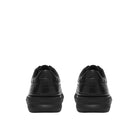 Rear view of the CLARKS Men's Code Hybrid Plain Wide Black Smooth shoe, padded heel and leather counter.