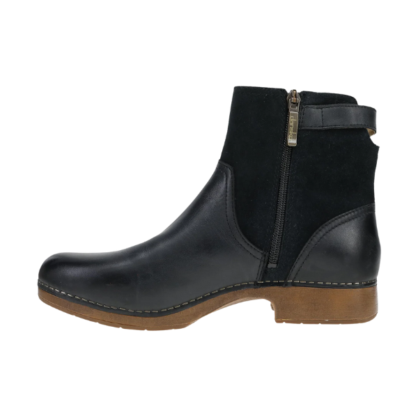 Dansko Women's Monique Black bootie by DANSKO features a side zipper, brown sole, and suede/leather upper.