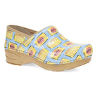 DANSKO Women's XP 2.0 Butter Patent clog, glossy cream patent leather upper, angled side view.