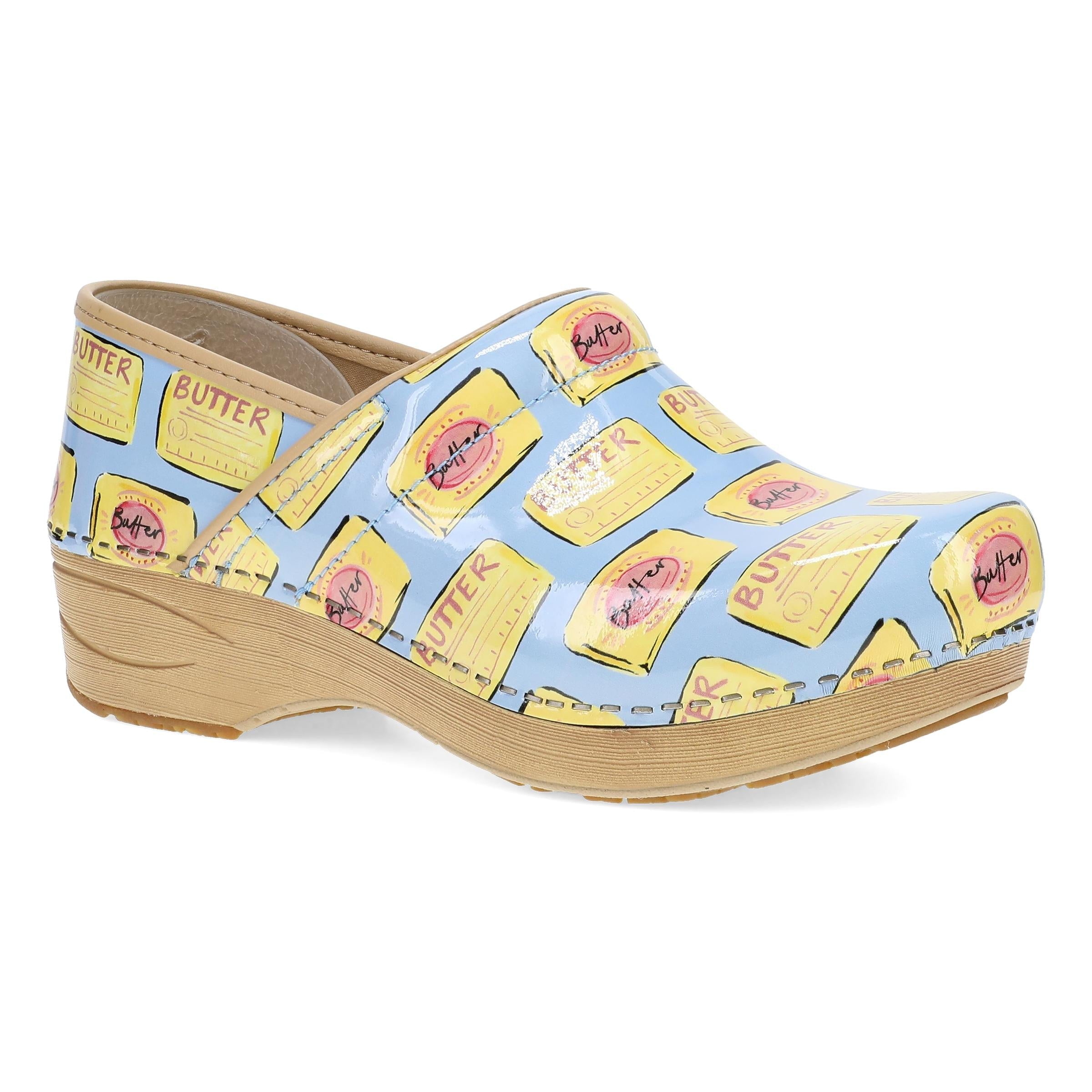 DANSKO Women's XP 2.0 Butter Patent clog, glossy cream patent leather upper, angled side view.