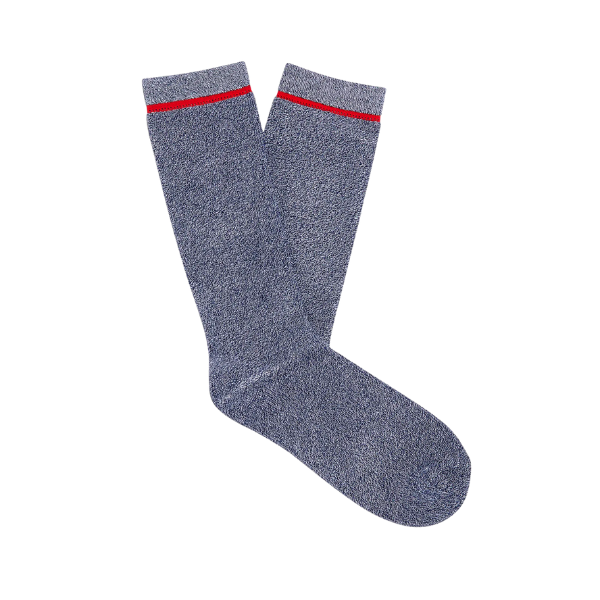 A pair of UGG Men's Kyro Crew Sock Navy featuring blue speckles and a red stripe near the top, laid flat on a white background.
