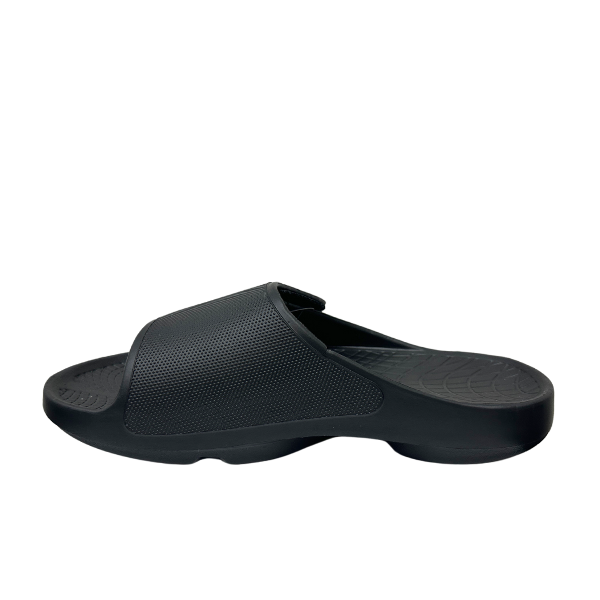 The Sovella Mens PF Velcro Slide Black by SOVELLA is a comfort recovery sandal with arch support, a textured upper strap, and contoured footbed, shown on a plain white background.