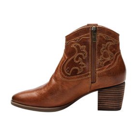 Aetrex Women's Reagan Heel Boot Cognac by AETREX WORLDWide INC: A brown leather ankle boot with decorative stitching, side zipper, stacked block heel, and built-in arch support for all-day comfort.