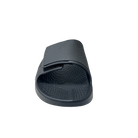 The Sovella Mens PF Velcro Slide Black by SOVELLA is shown from the front with a textured sole and Wide adjustable strap, offering arch support for comfort recovery. The sandal is displayed on a white background.