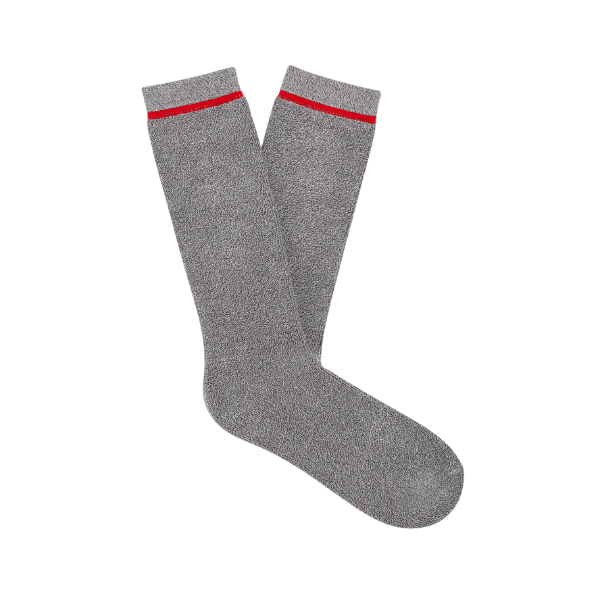 The UGG Men's Kyro Crew Sock in grey features a subtle texture and thin red stripe near the top, shown on a white background. Pair these stylish UGG crew socks with your favorite outfits for everyday comfort.