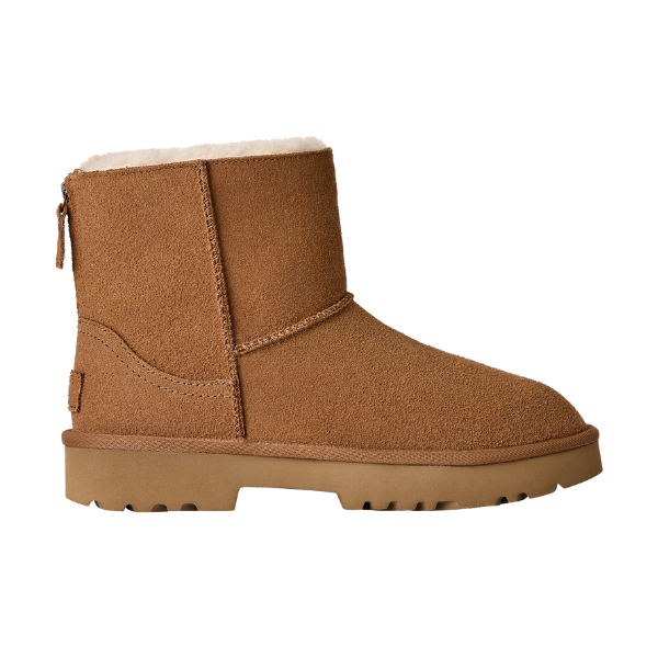 The UGG Women's Marais Zip Up Chestnut boot features tan suede, a flat ridged sole, and white fleece lining, shown from the side against a white background.