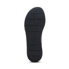 The image shows the black rubber sole of the Aetrex Women's Ariel Black by AETREX WORLDWide INC, viewed from the bottom, with four horizontal traction grooves and a textured surface—ideal for foot pain relief in wedge sandals.