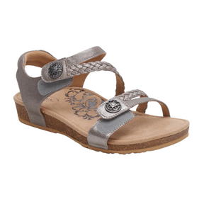 The Aetrex Womens Jillian Brushed-Silver sandal by AETREX WORLDWIDE INC features two braided adjustable straps with metal buttons, a metallic silver finish, cork sole, low wedge heel, floral-patterned insole, and orthotic footbed for comfort.