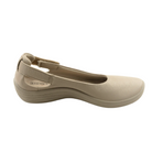 The Arcopedico Womens Jasmund Taupe by ARCOPEDICO is a taupe vegan slip-on ballerina flat with a closed toe, slight wedge heel, elastic back strap, side label, smooth texture, and gentle arch support.