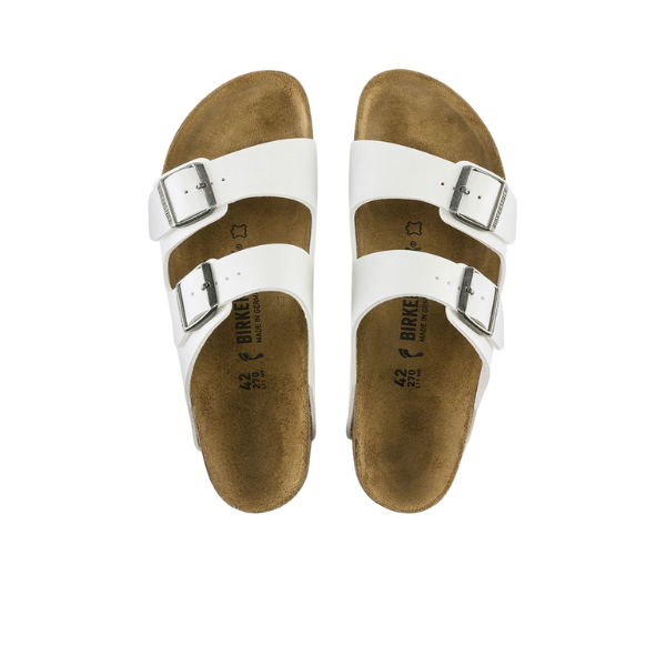 The BIRKENSTOCK Womens Arizona Birko-Flor White sandals have two white Birko-Flor straps with silver buckles and brown contoured footbeds, shown on a white background.