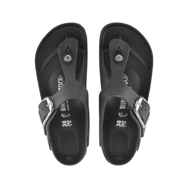 A pair of Birkenstock Womens Gizeh Big Buckle Oiled Leather Black sandals by BIRKENSTOCK, featuring contoured footbeds and large silver buckles, shown from above on a white background.