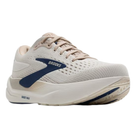 The BROOKS Men's Ghost Max 3 Coconut is a light beige running shoe with cushioned support, thick white sole, blue accents, mesh-like breathable upper, classic lace-up design, and "BROOKS" on the side.