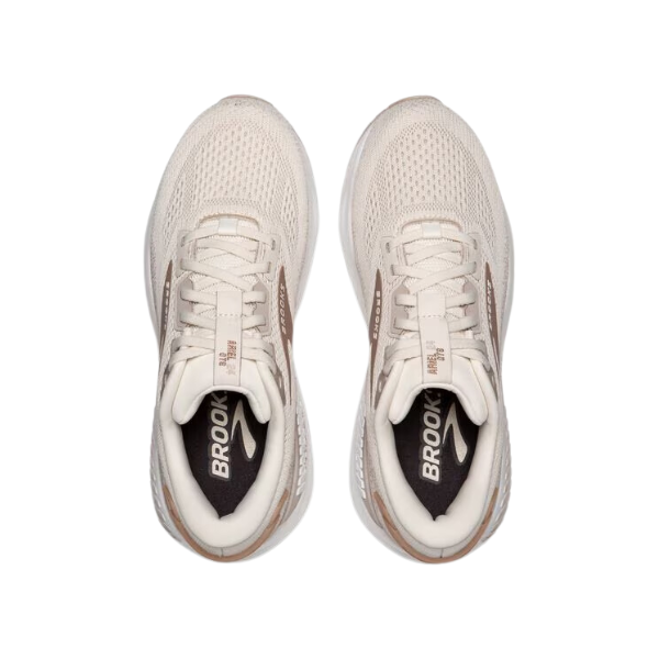 A top-down view of BROOKS Womens Ariel GTS 24 Wide Coconut sneakers with white laces and brown accents, Brooks logo on the insoles, and GuideRails support system, shown side by side on a white background.