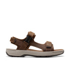 The CLARKS Clarks Mens Saltway Edge Wide Tan sandal features brown and light tan leather, adjustable straps with a black buckle, a foam footbed, and a cushioned light gray sole with dark tread, shown in side profile on a white background.