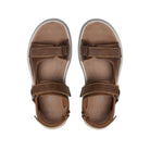 Top view of CLARKS Saltway Edge Wide Tan mens sandals, featuring light tan leather, adjustable straps, visible stitching, and a cushioned foam footbed, displayed side by side on a white background.