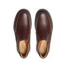 A pair of Clarks Mens Un Briley Step Leather Wide Mahogany slip-on shoes with tan interiors, shown from above on a white background. The contoured insoles display the CLARKS brand name, emphasizing comfort.