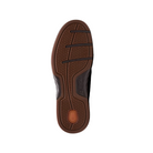 The image shows the sole of a Clarks Mens Un Briley Step Leather Wide Mahogany shoe with a textured grip, black horizontal grooves, and an orange oval near the heel, photographed against a white background.